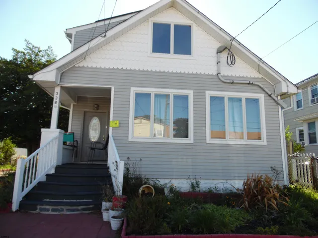 a front view of a house with stairs