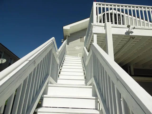 a kitchen with stainless steel appliances granite countertop a stove and a microwave