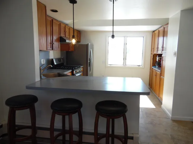 a view of a room with window and wooden floor