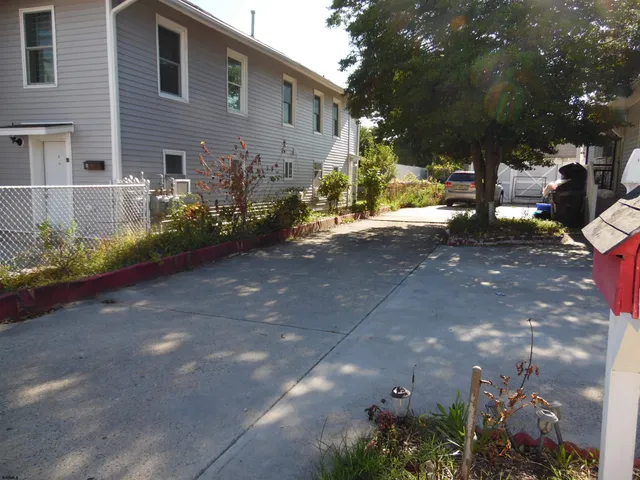 a view of a house with a street
