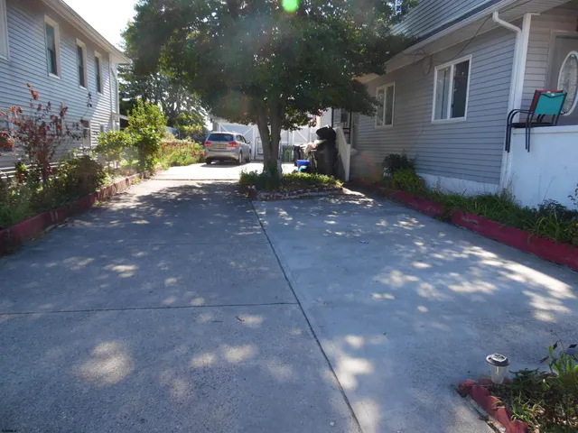 a view of walk in closet with wooden floor