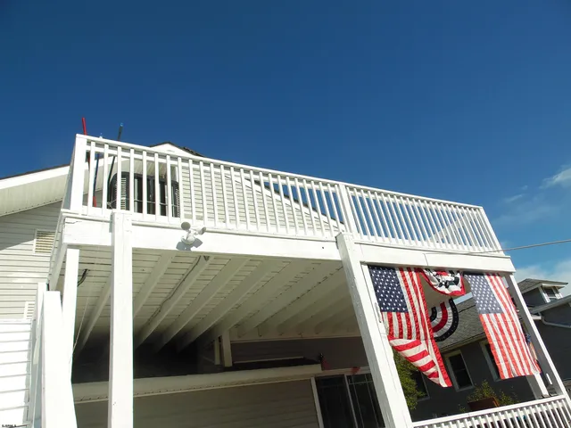a view of balcony with wooden floor