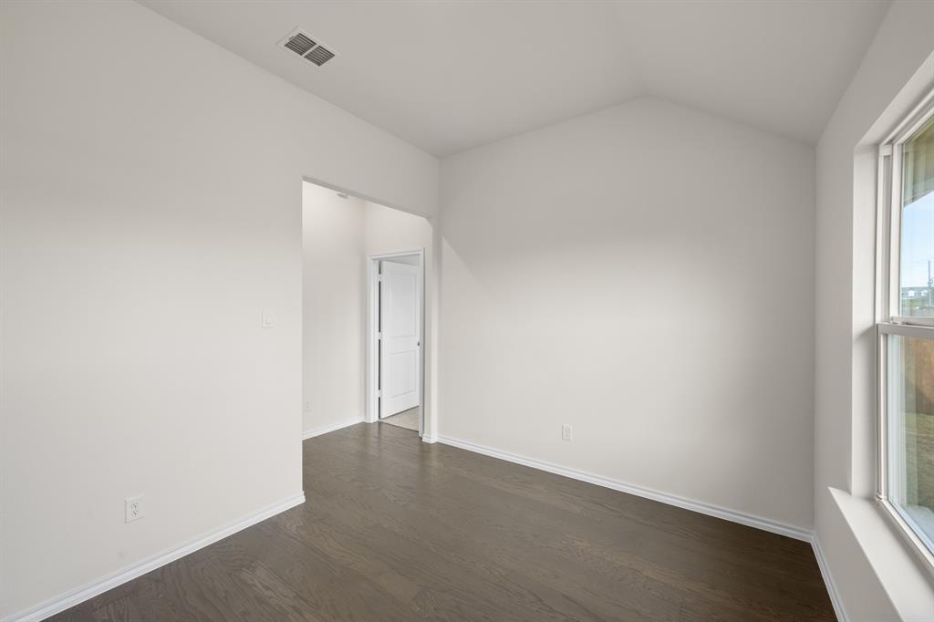 810 Misty Lane Cleburne, TX 76033 - Photo 11 of 30 an empty room with windows