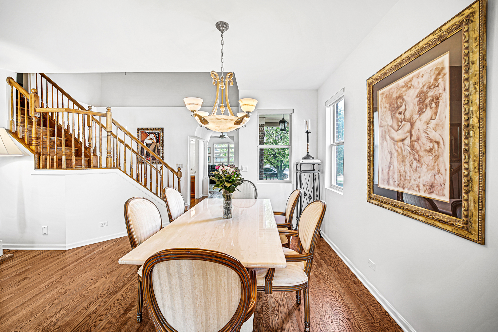 726 St Johns Place Addison, IL 60101 - Photo 14 of 39 a view of a dining room with furniture window and wooden floor