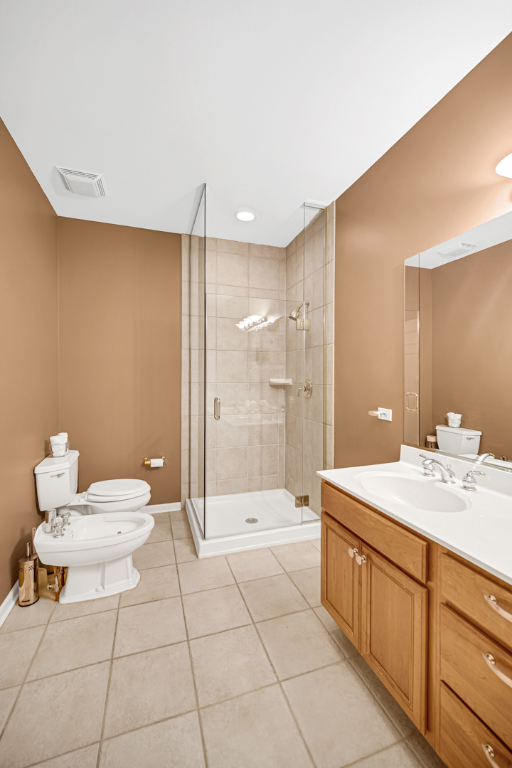 726 St Johns Place Addison, IL 60101 - Photo 18 of 39 a bathroom with a sink a toilet and shower