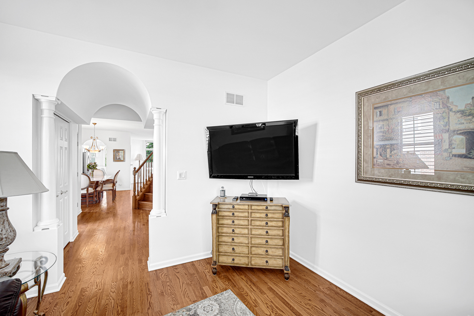 726 St Johns Place Addison, IL 60101 - Photo 21 of 39 a living room with furniture and a flat screen tv