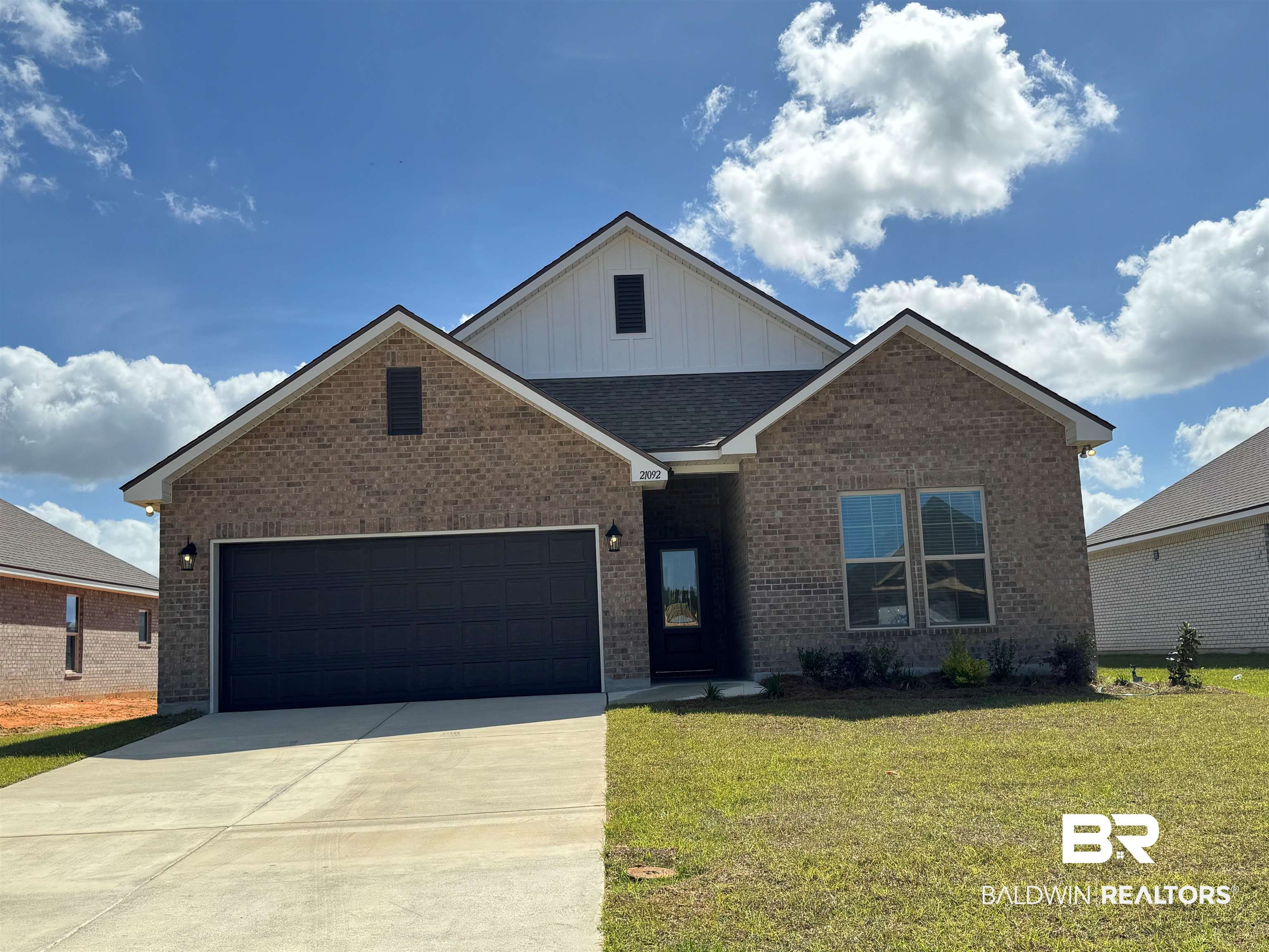 21092 Explorer Drive Robertsdale, AL 36567 - Photo 1 of 3 Contemporary-style facade featuring brick and vertical siding accents