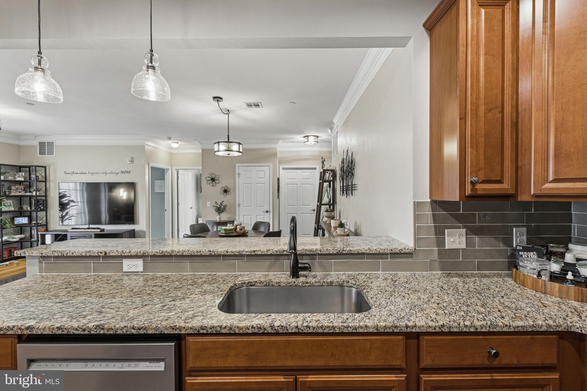 5217 Poplar Street Garnet Valley, PA 19060 - Photo 12 of 32 a kitchen with kitchen island granite countertop a sink stainless steel appliances and cabinets