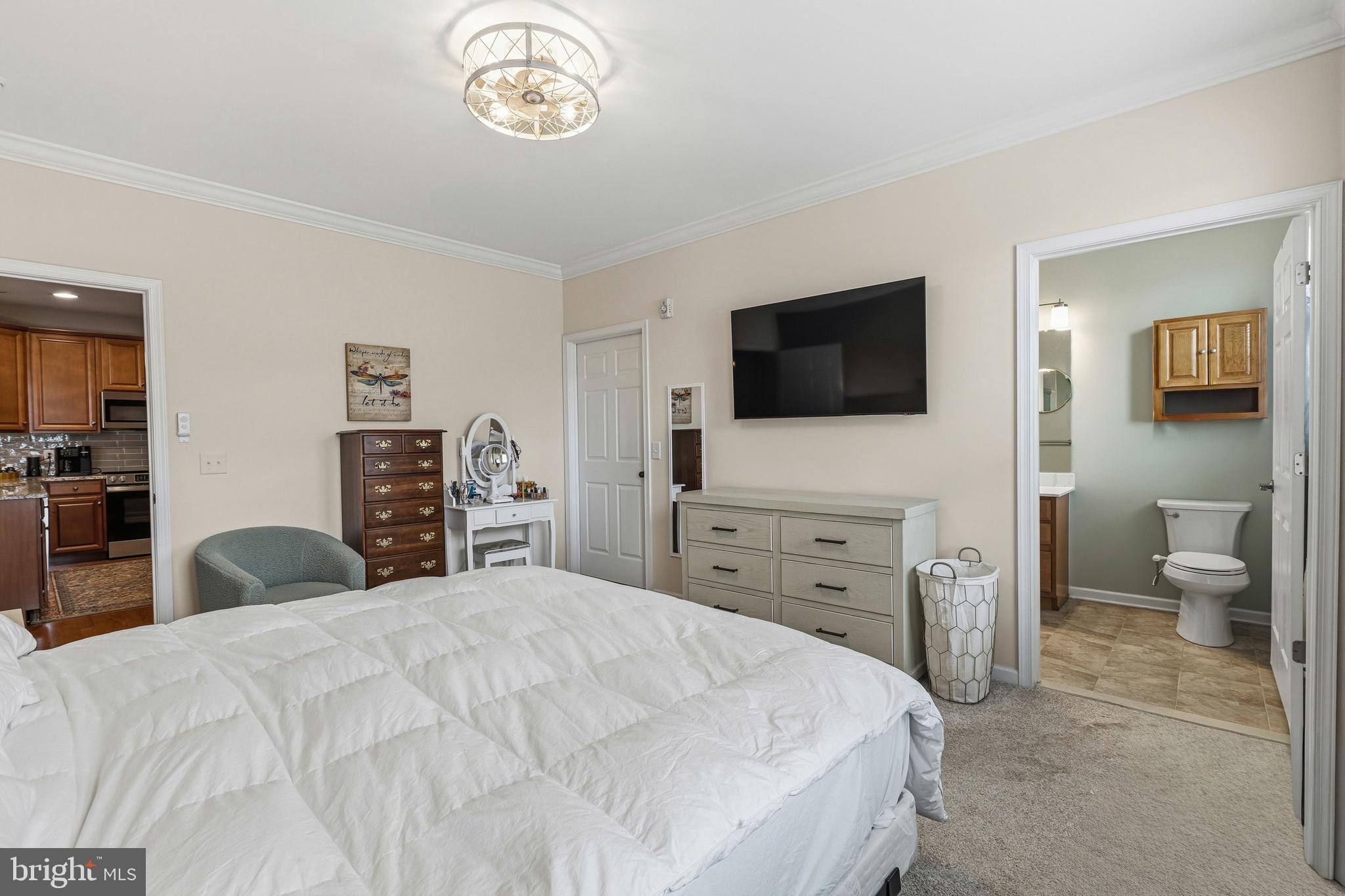 5217 Poplar Street Garnet Valley, PA 19060 - Photo 20 of 32 a bedroom with a bed and a flat screen tv
