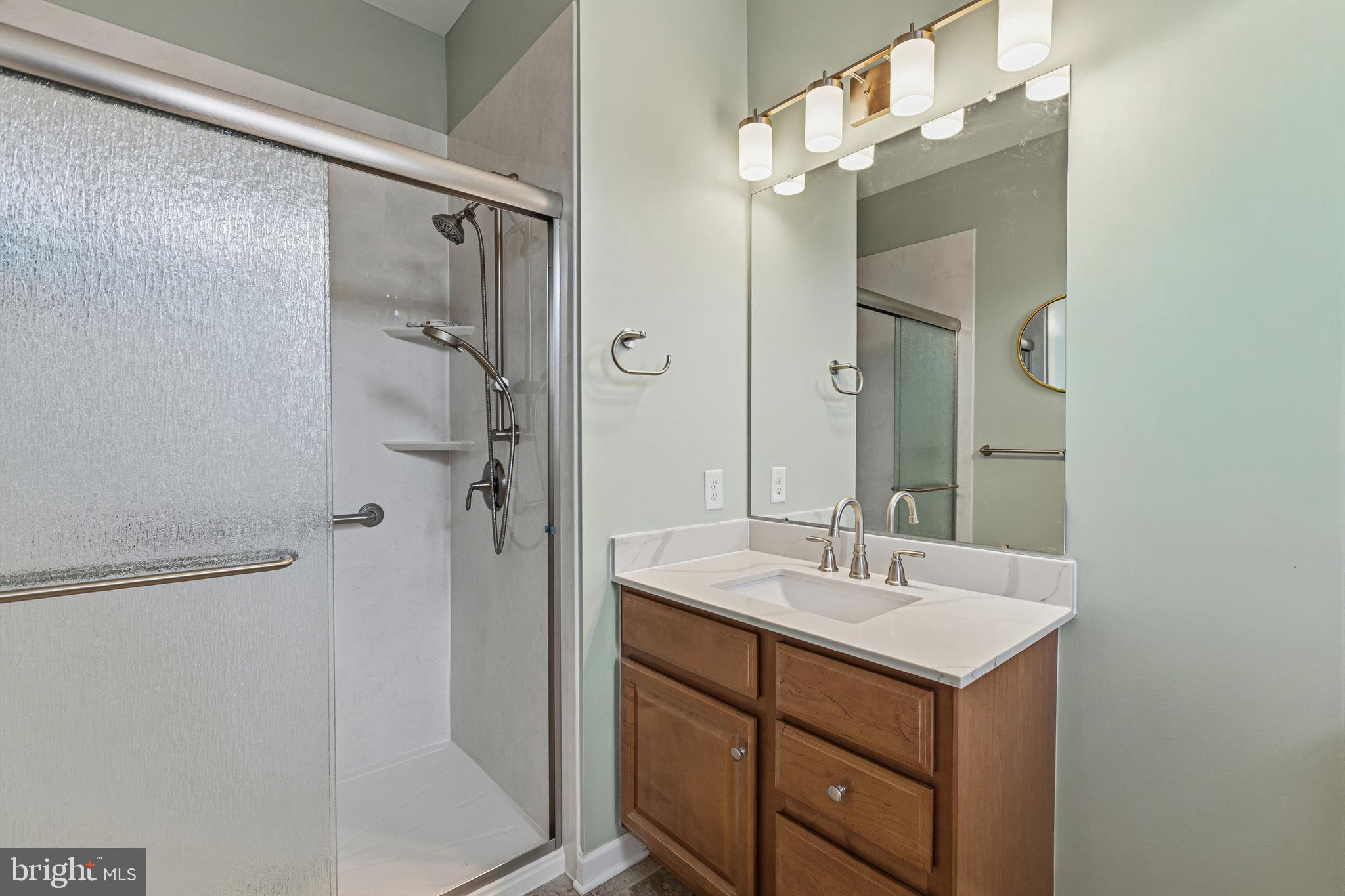 5217 Poplar Street Garnet Valley, PA 19060 - Photo 21 of 32 a bathroom with a sink double vanity and shower