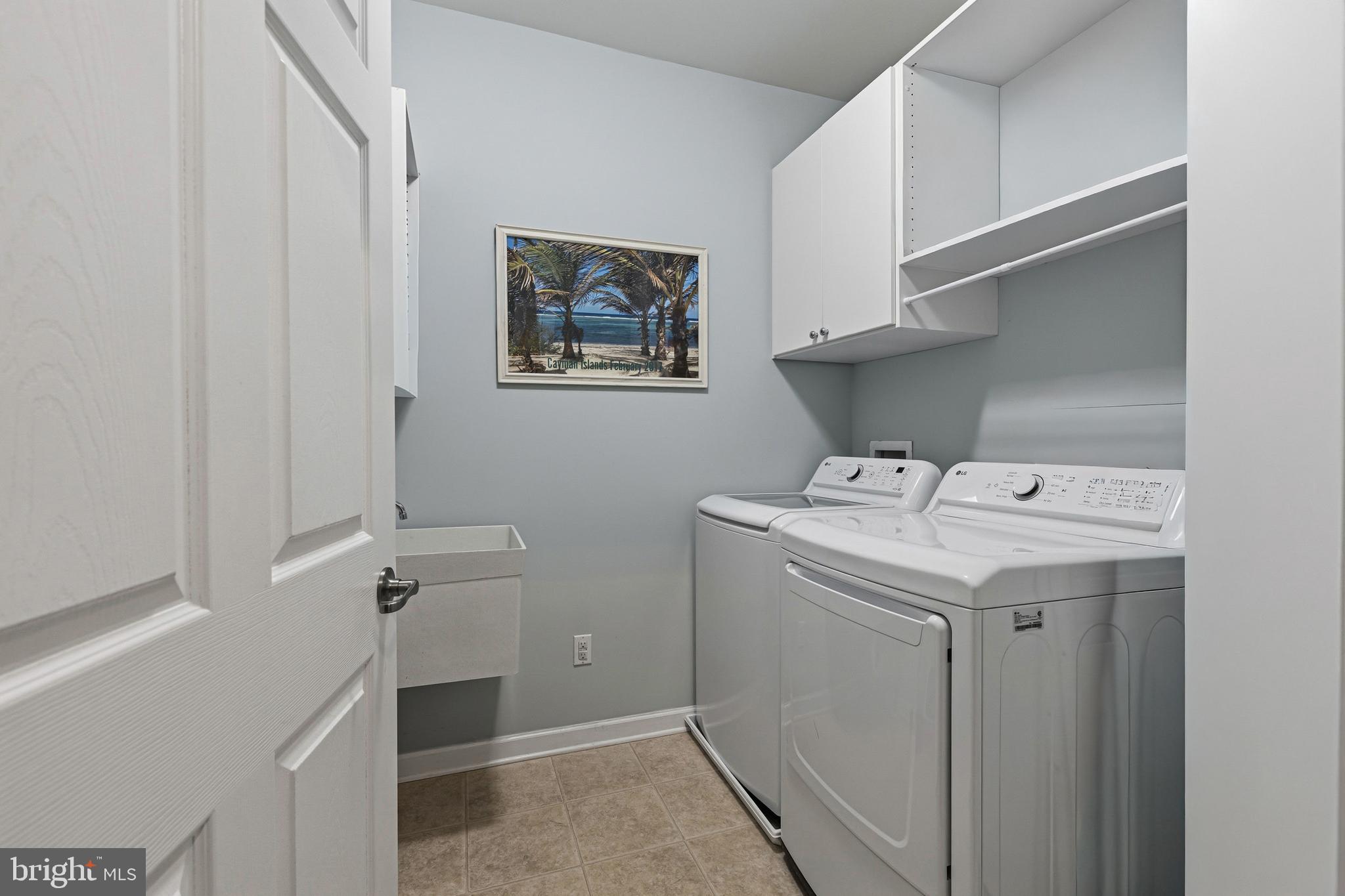 5217 Poplar Street Garnet Valley, PA 19060 - Photo 22 of 32 a utility room with dryer and washer