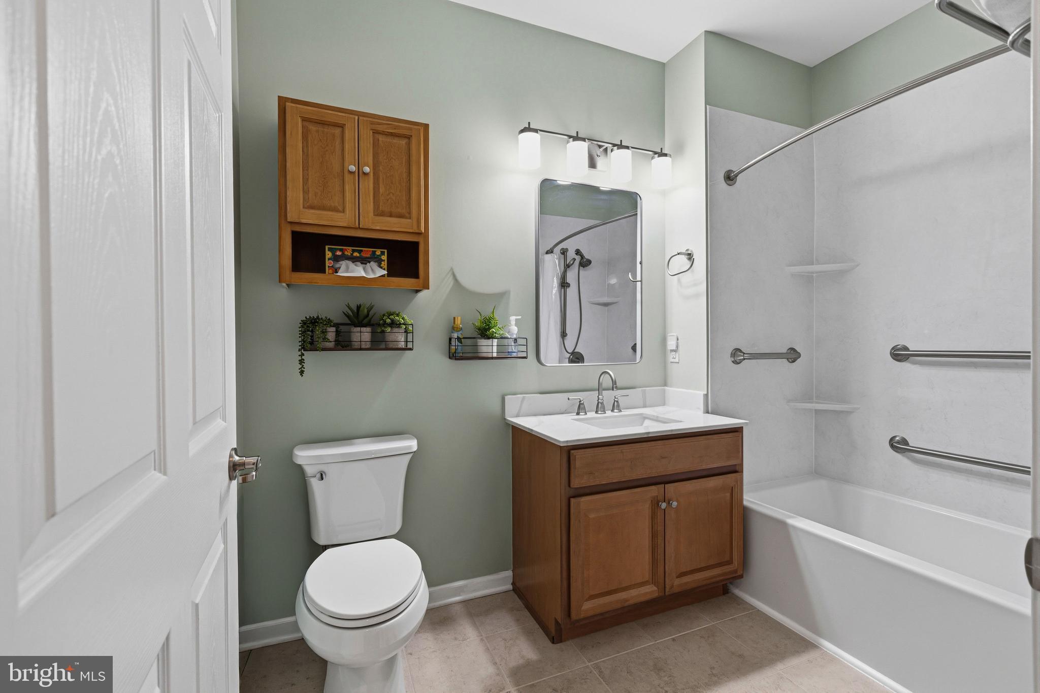 5217 Poplar Street Garnet Valley, PA 19060 - Photo 23 of 32 a bathroom with a toilet sink and mirror
