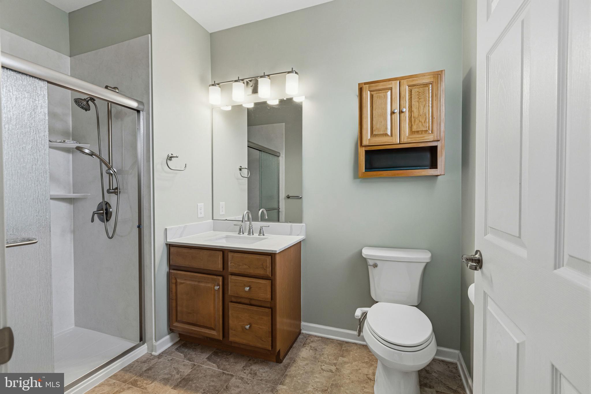 5217 Poplar Street Garnet Valley, PA 19060 - Photo 26 of 32 a bathroom with a toilet sink and shower