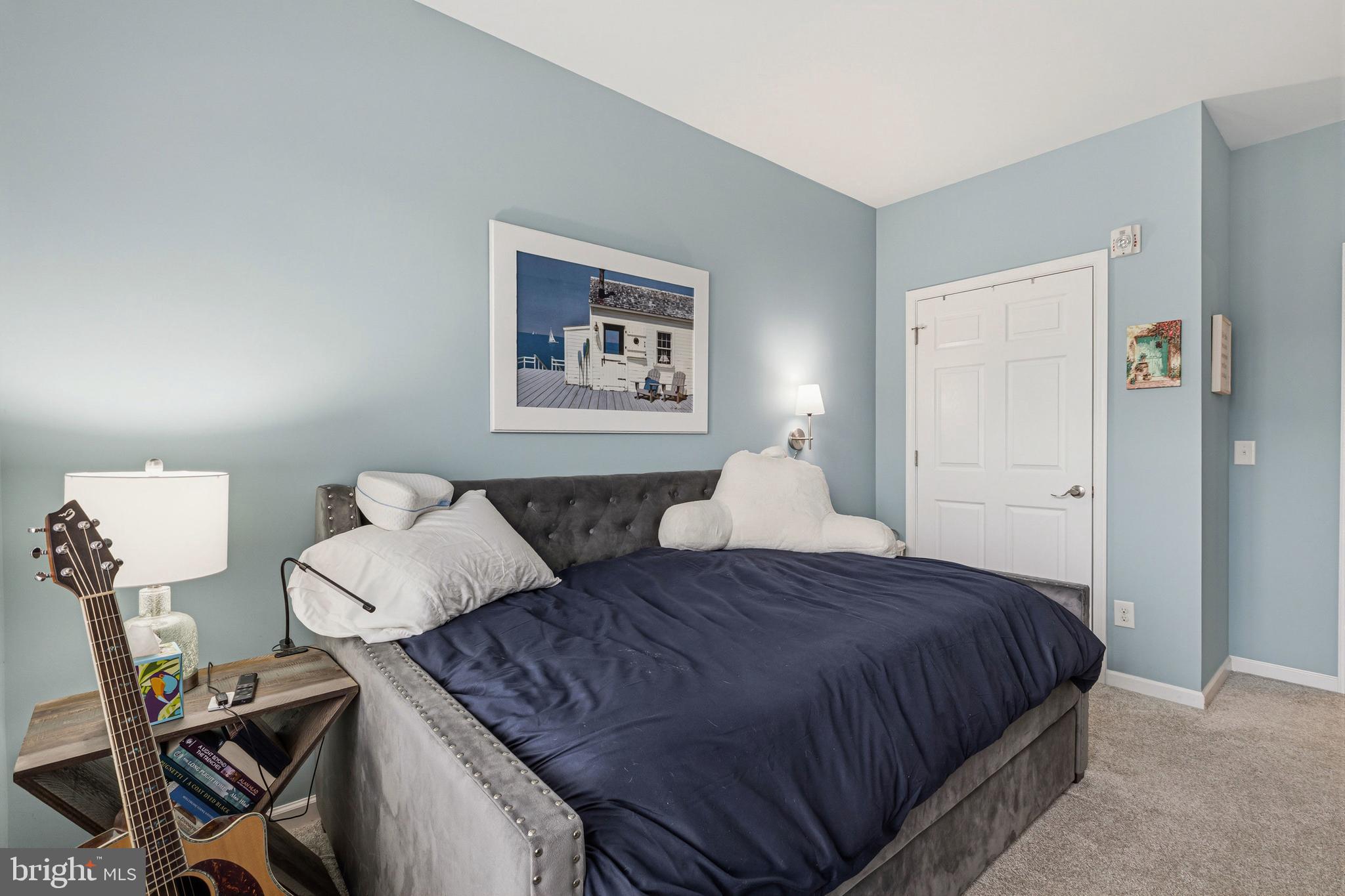 5217 Poplar Street Garnet Valley, PA 19060 - Photo 27 of 32 a spacious bedroom with a bed and a table in it
