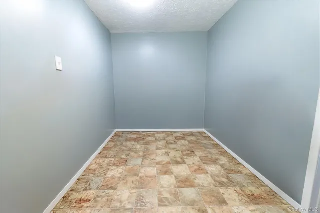 a bedroom with two beds and a chandelier