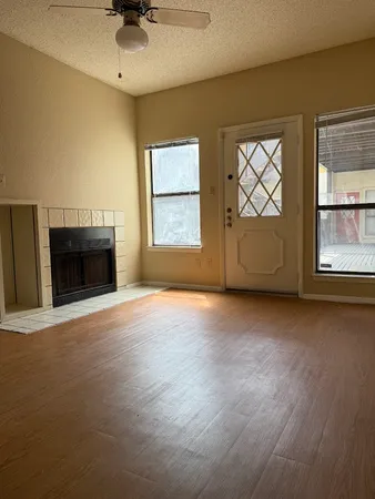 a view of an empty room with a window