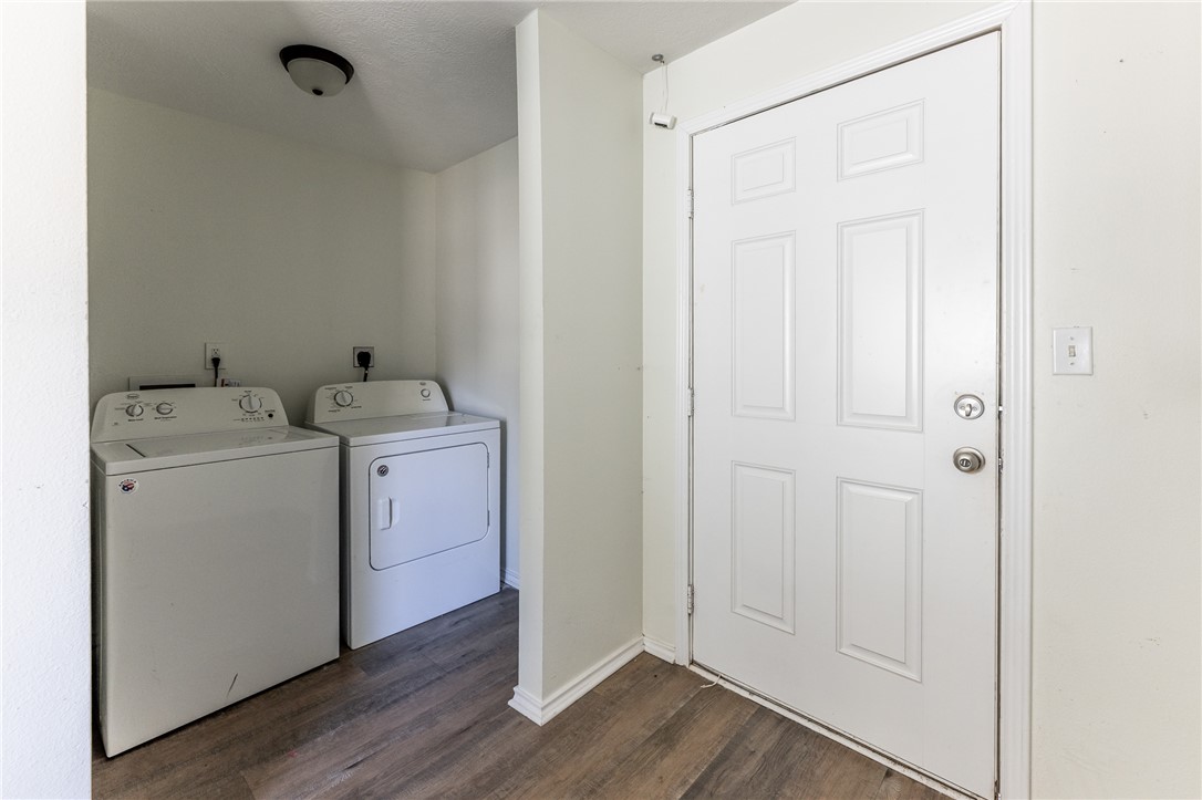 1117 East Sycamore Street Navasota, TX 77868 - Photo 18 of 24 a utility room with dryer and washer