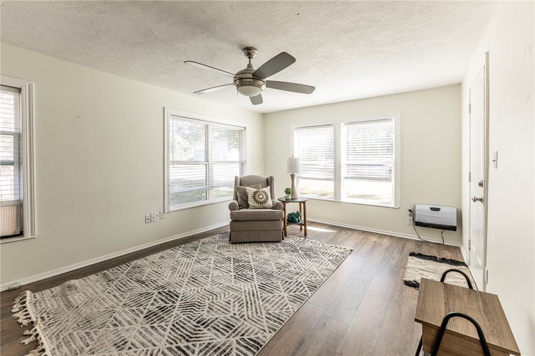 1117 East Sycamore Street Navasota, TX 77868 - Photo 4 of 24 a living room with furniture and a window