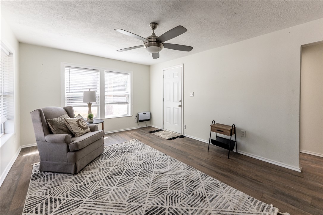 1117 East Sycamore Street Navasota, TX 77868 - Photo 10 of 24 a living room with furniture and a window