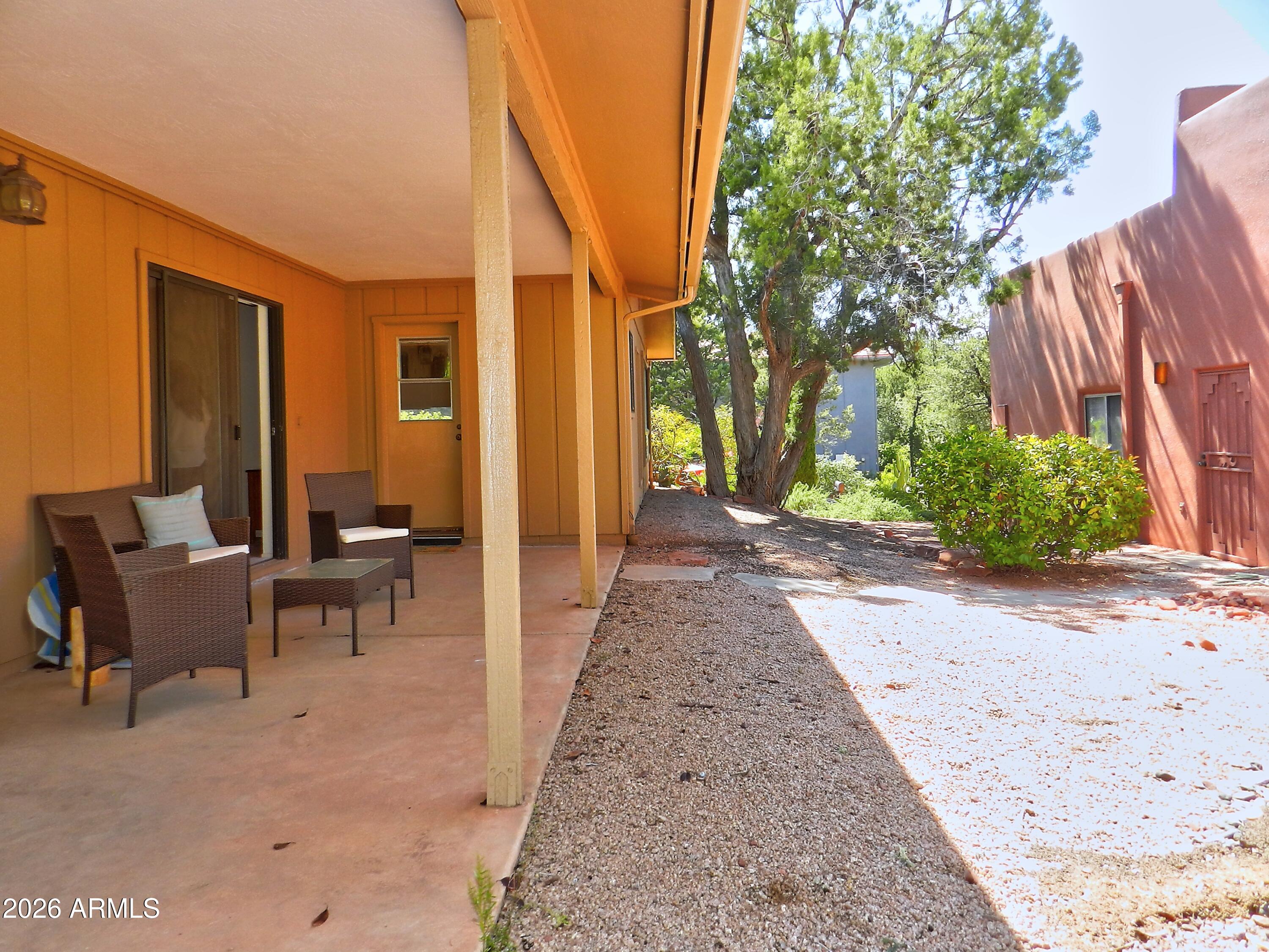 550 Barcelona Road Sedona, AZ 86336 - Photo 26 of 32 a view of a patio with table and chairs and potted plants