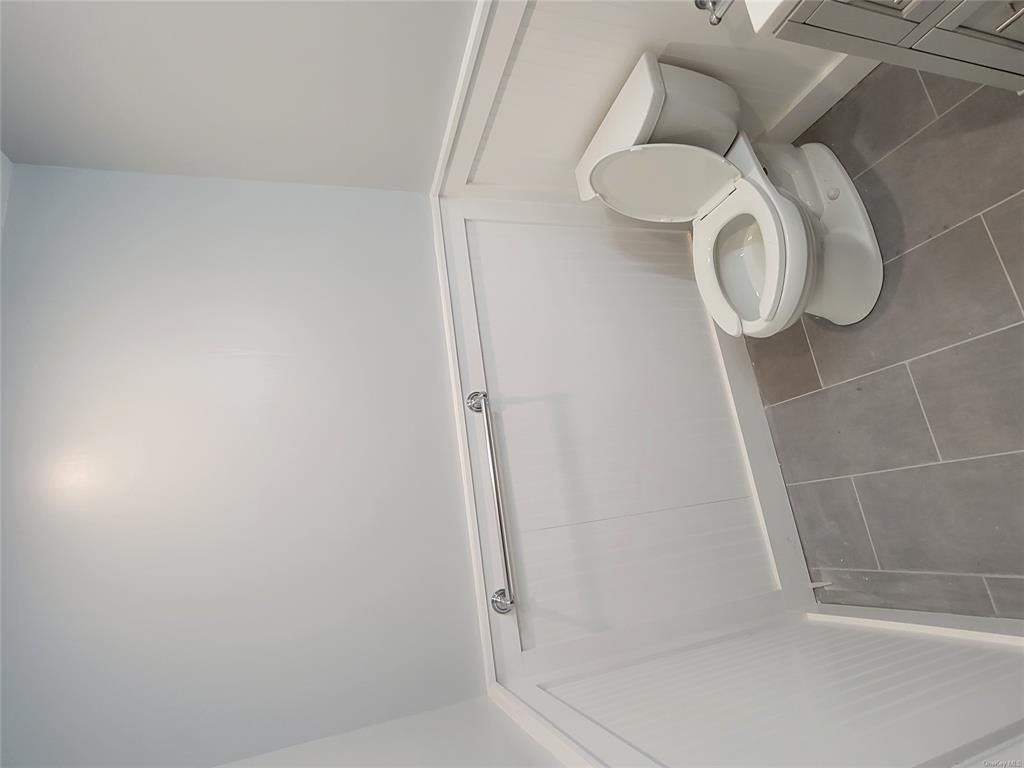 731 Broadway, Unit 3 Valhalla, NY 10595 - Photo 13 of 14 Bathroom featuring tile patterned flooring, vanity, and toilet