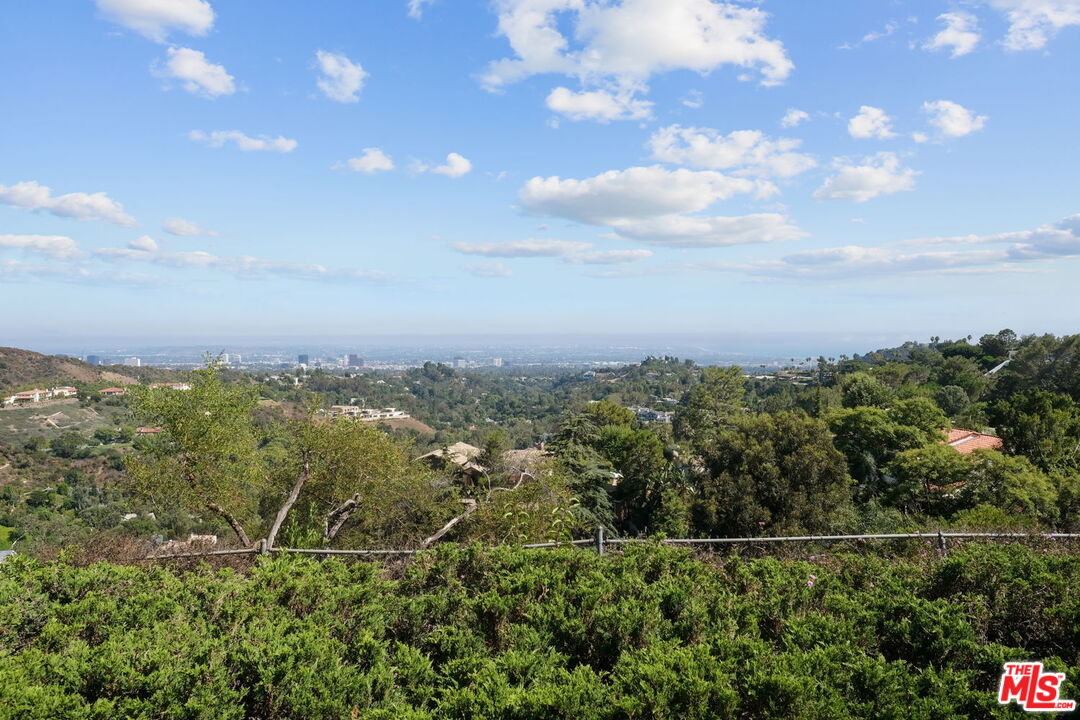 2526 Cordelia Road Los Angeles, CA 90049 - Photo 10 of 35 a view of a yard and mountain view in back