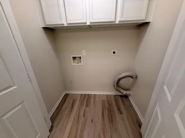 a view of wooden floor in a bathroom