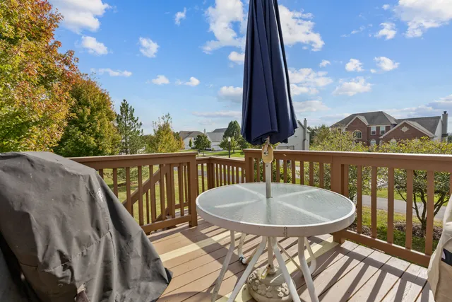 a view of a chairs and table in the balcony