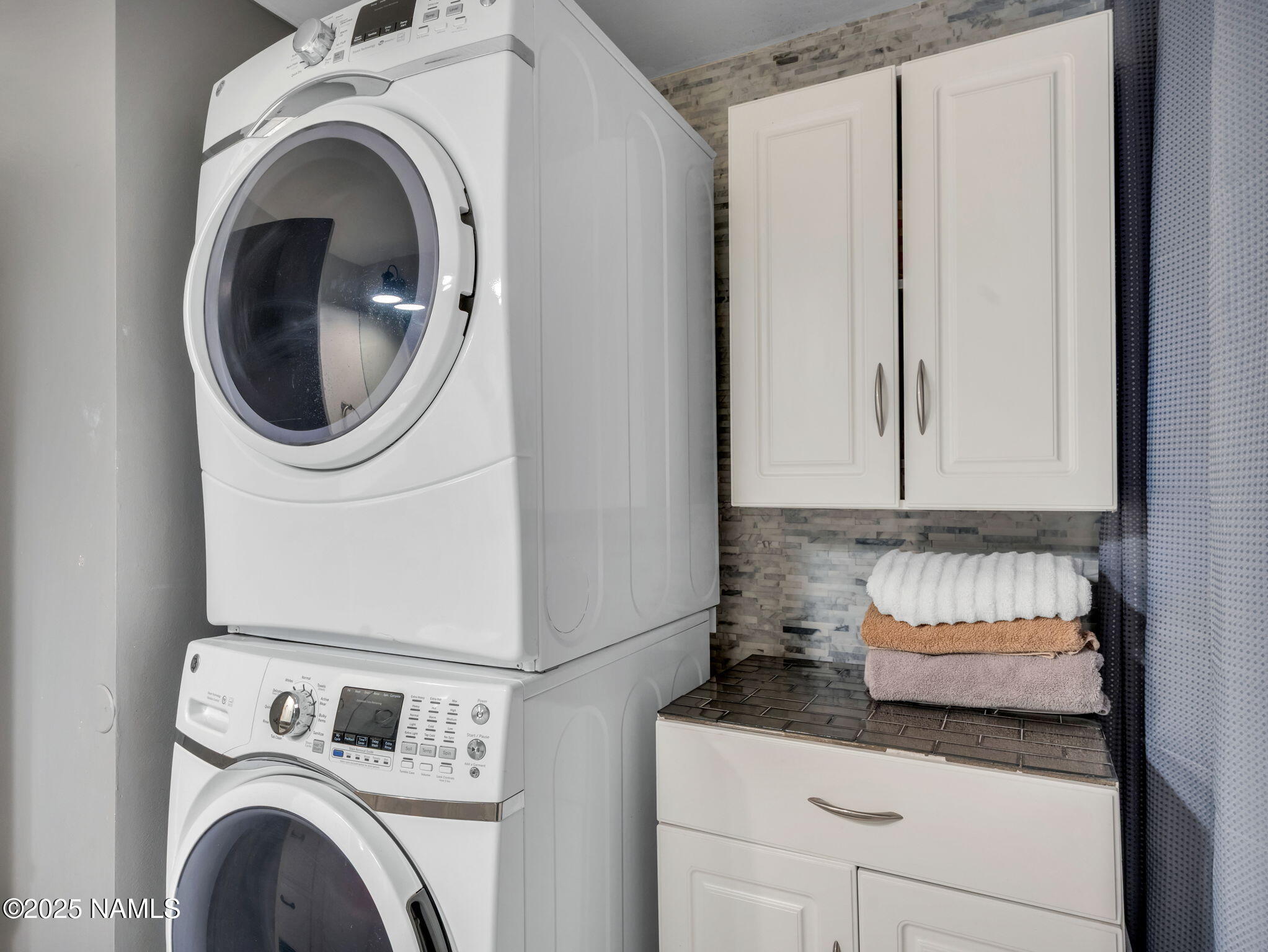 4449 Canyon Loop Flagstaff, AZ 86005 - Photo 12 of 37 a close view of a utility room with dryer and washer