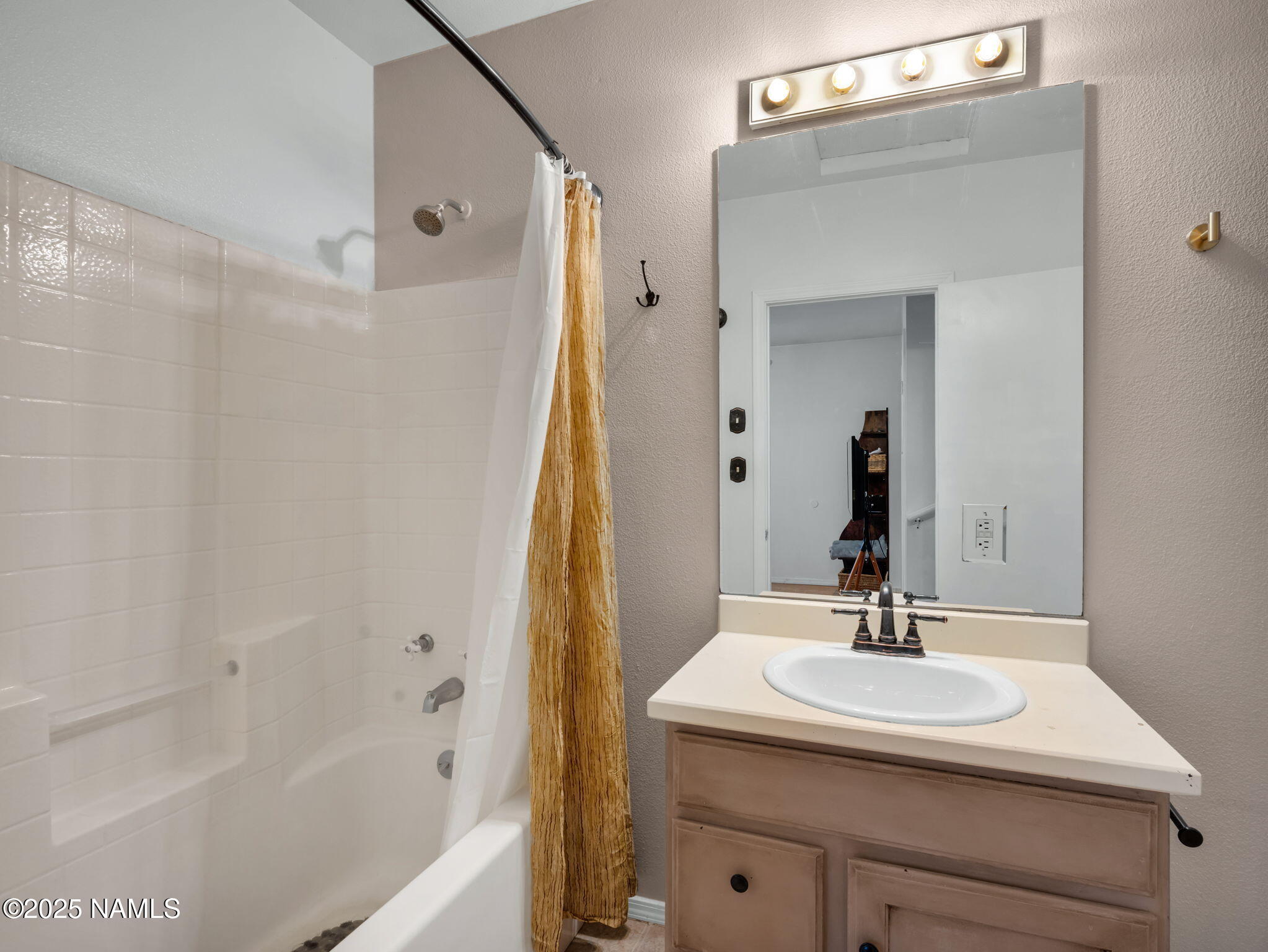 4449 Canyon Loop Flagstaff, AZ 86005 - Photo 15 of 37 a bathroom with a sink and a mirror