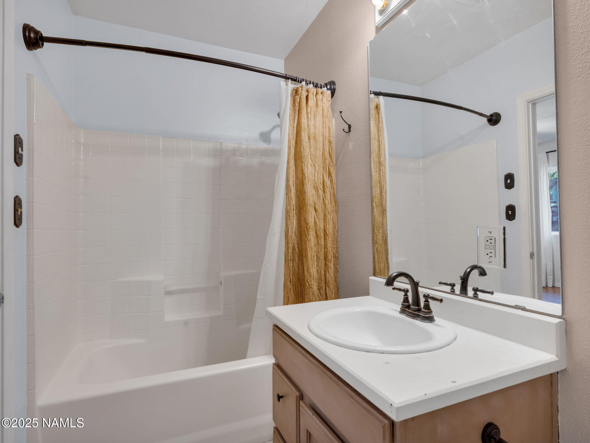 4449 Canyon Loop Flagstaff, AZ 86005 - Photo 16 of 37 a bathroom with a sink and a mirror
