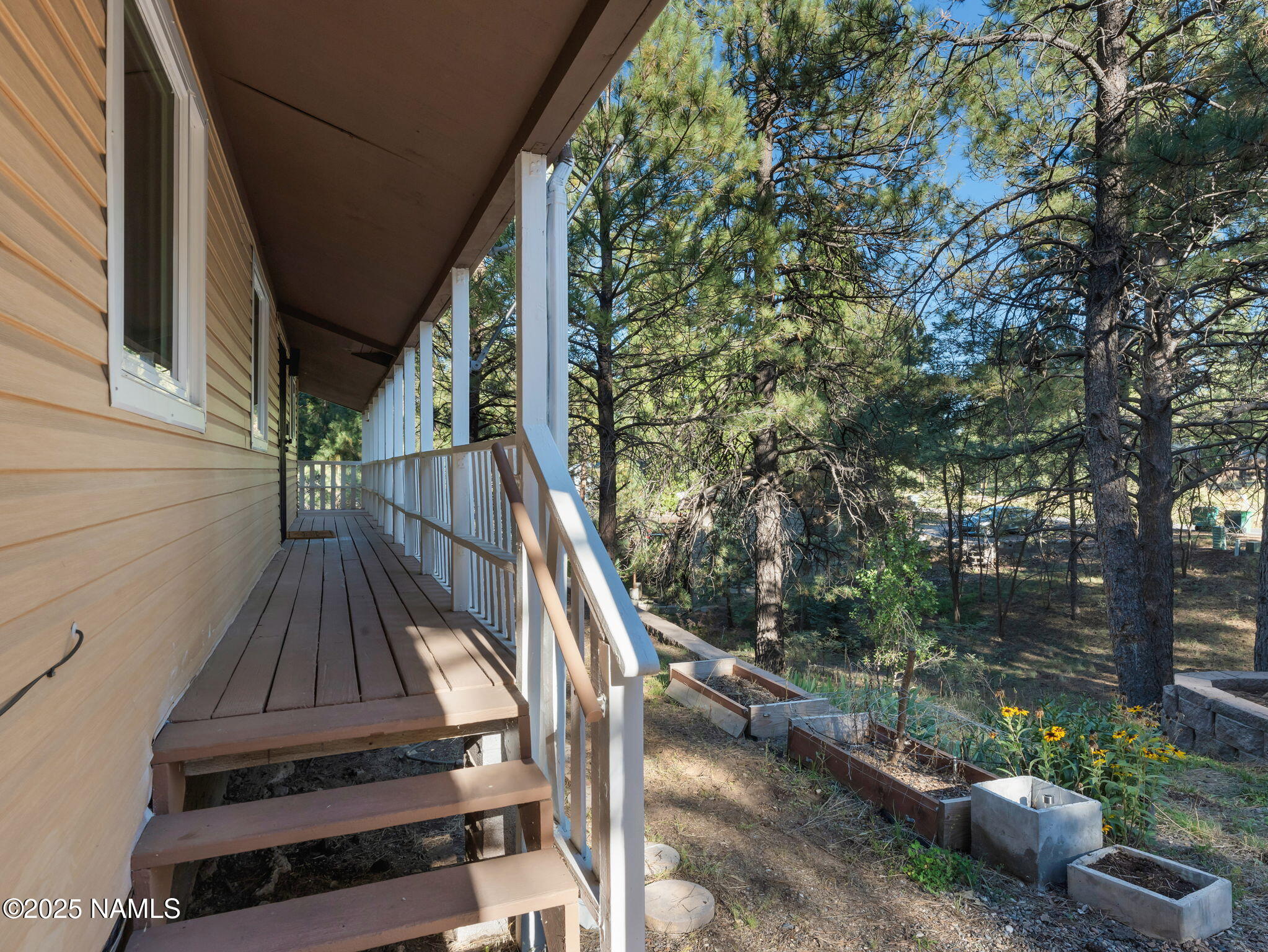 4449 Canyon Loop Flagstaff, AZ 86005 - Photo 20 of 37 a view of balcony with wooden floor and fence