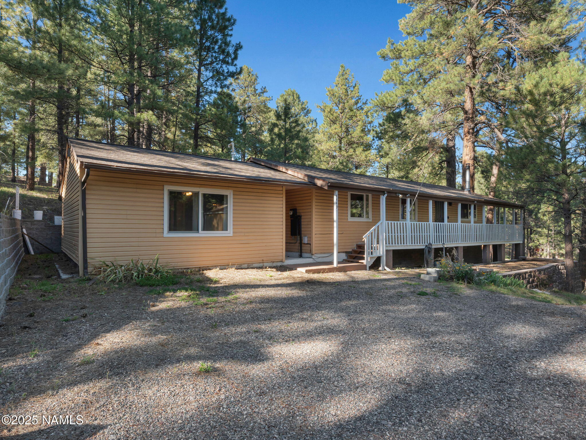 4449 Canyon Loop Flagstaff, AZ 86005 - Photo 29 of 37 a view of a house with a yard