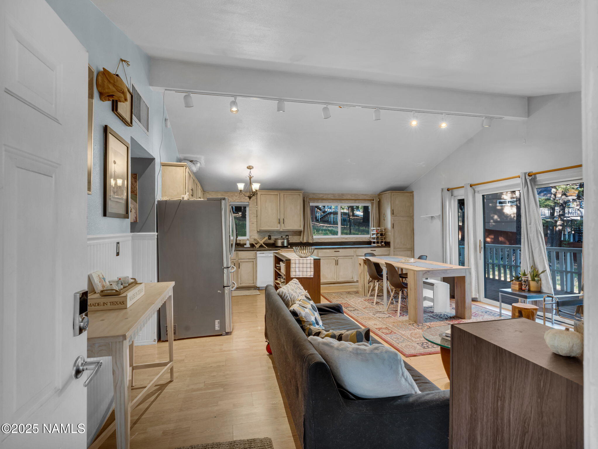 4449 Canyon Loop Flagstaff, AZ 86005 - Photo 3 of 37 a living room with furniture a large window and kitchen view