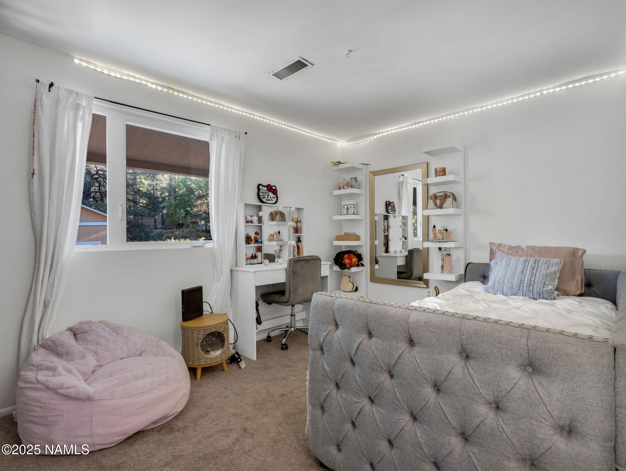 4449 Canyon Loop Flagstaff, AZ 86005 - Photo 10 of 37 a bedroom with bed and a couch
