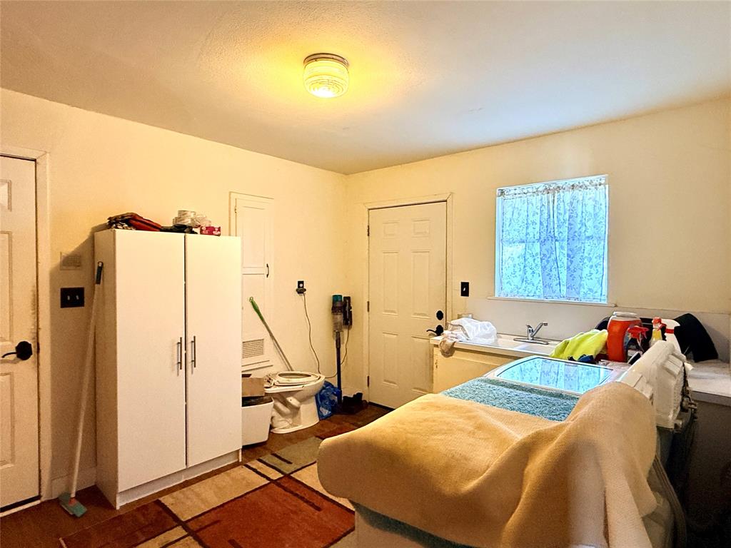 429 Agnes Avenue Marlin, TX 76661 - Photo 12 of 28 a bed sitting in a room next to a window