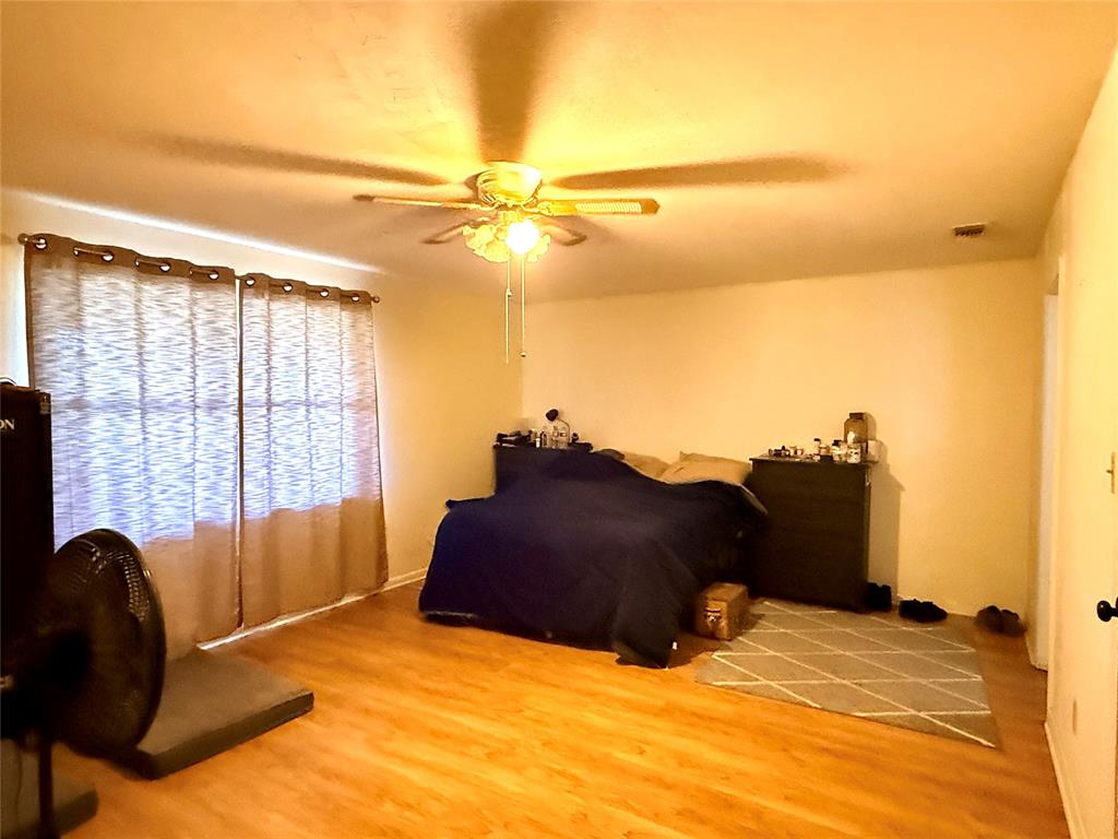 429 Agnes Avenue Marlin, TX 76661 - Photo 15 of 28 a bedroom with a bed window and dresser
