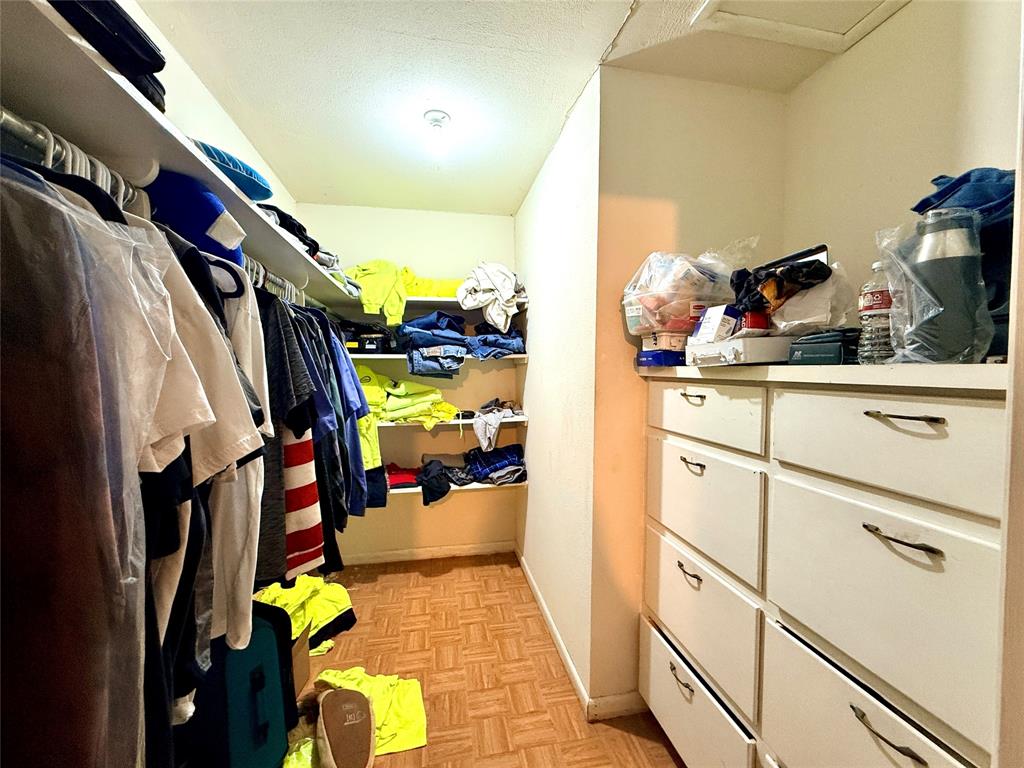 429 Agnes Avenue Marlin, TX 76661 - Photo 16 of 28 a view of walk in closet with clothes and shoes