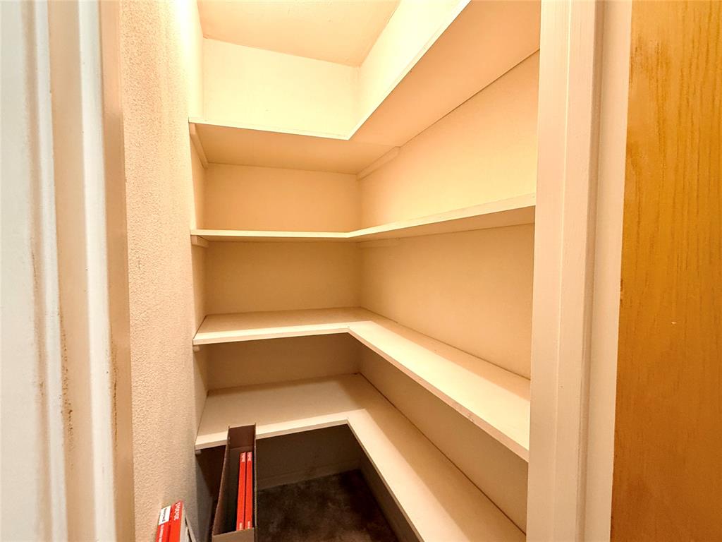 429 Agnes Avenue Marlin, TX 76661 - Photo 21 of 28 a view of walk in closet with empty racks