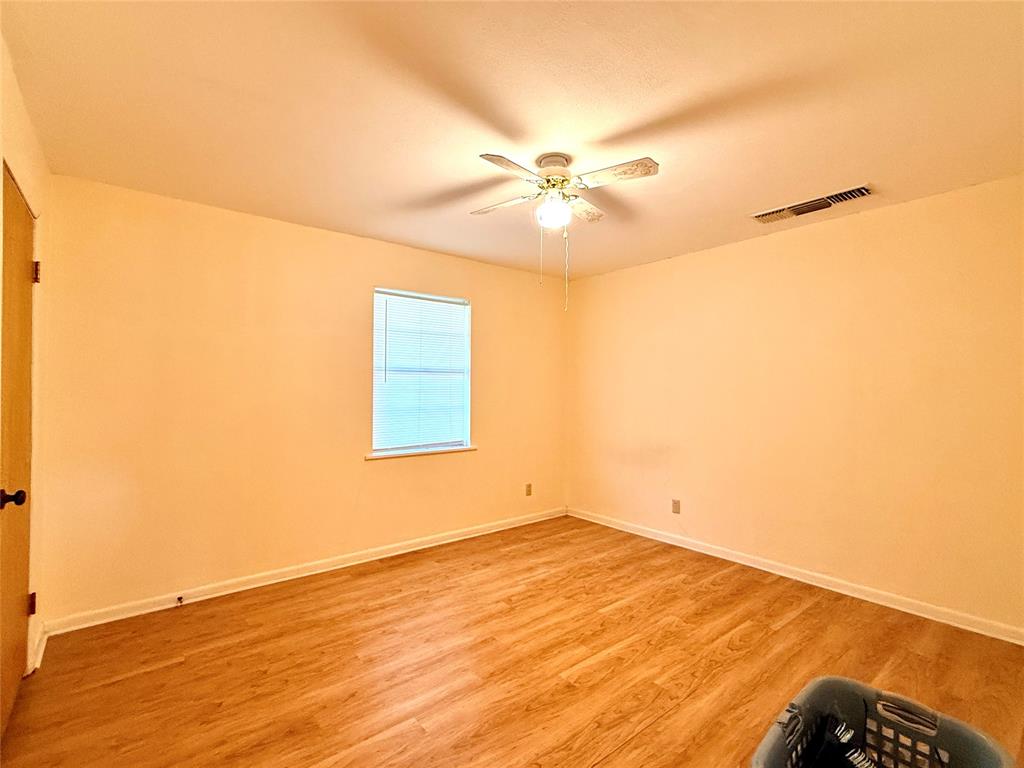 429 Agnes Avenue Marlin, TX 76661 - Photo 24 of 28 a view of empty room with wooden floor and fan