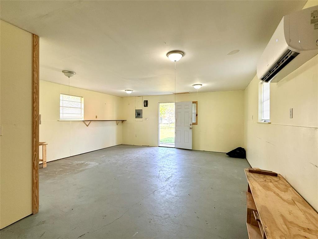 429 Agnes Avenue Marlin, TX 76661 - Photo 27 of 28 a view of empty room with wooden floor and windows