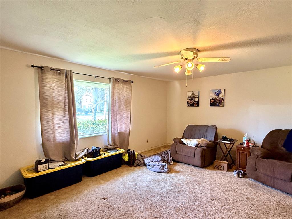 429 Agnes Avenue Marlin, TX 76661 - Photo 8 of 28 a living room with furniture gym equipment and a window