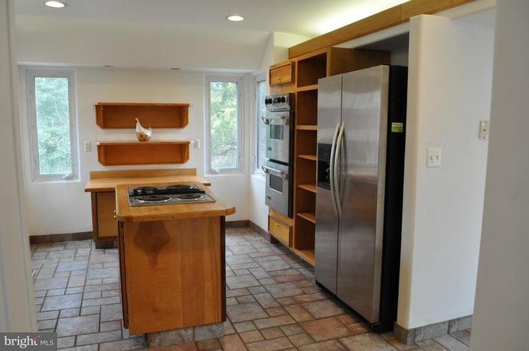 5300 Wertz Road Hampstead, MD 21074 - Photo 2 of 25 a kitchen with stainless steel appliances granite countertop a refrigerator and a stove