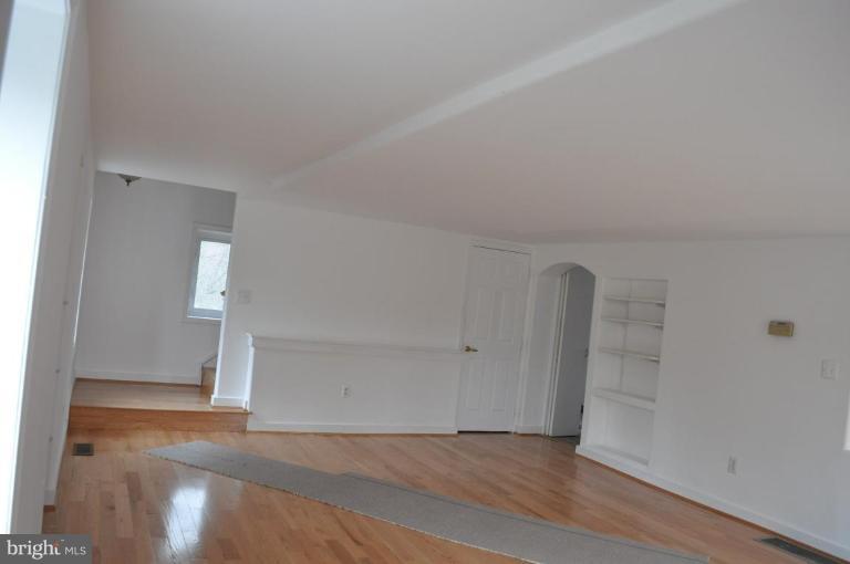5300 Wertz Road Hampstead, MD 21074 - Photo 20 of 25 an empty room with wooden floor and windows