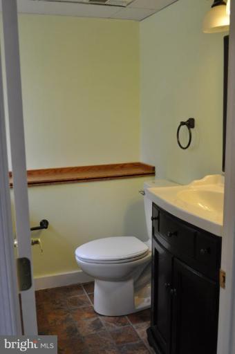 5300 Wertz Road Hampstead, MD 21074 - Photo 23 of 25 a bathroom with a granite countertop toilet and a sink