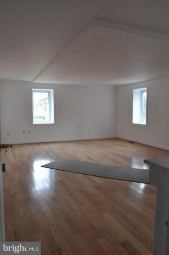 5300 Wertz Road Hampstead, MD 21074 - Photo 5 of 25 an empty room with wooden floor and windows