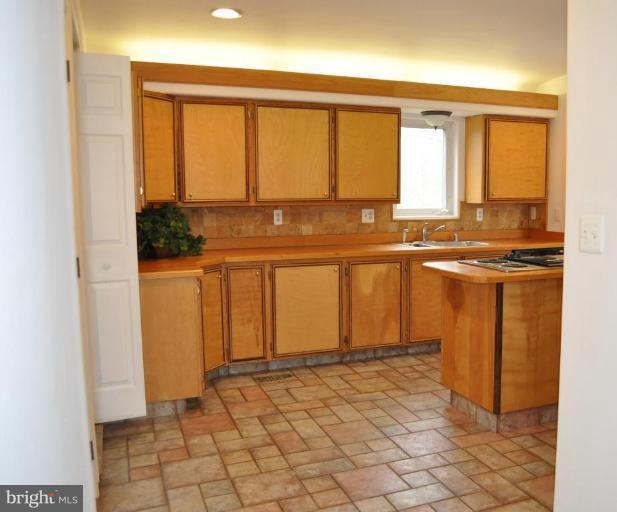5300 Wertz Road Hampstead, MD 21074 - Photo 7 of 25 a view of a kitchen with a sink and cabinets