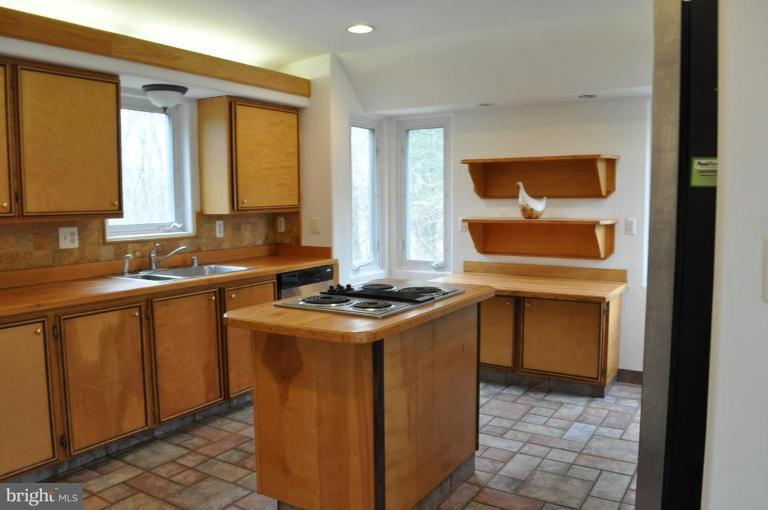 5300 Wertz Road Hampstead, MD 21074 - Photo 8 of 25 a kitchen with stainless steel appliances granite countertop a stove a sink and a refrigerator