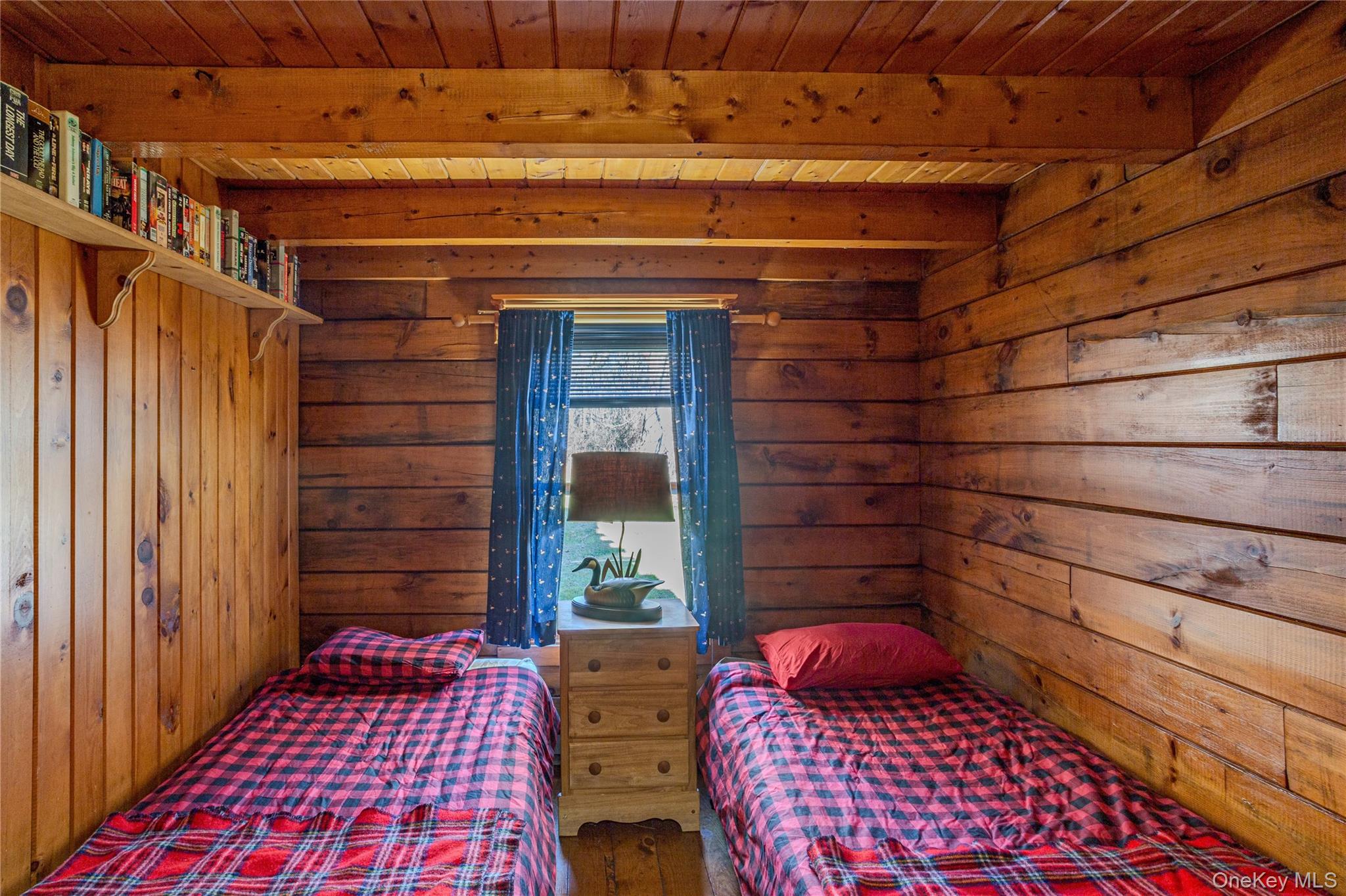 201 Basket Brook Road Long Eddy, NY 12760 - Photo 13 of 34 a bedroom with a bed and wooden floor