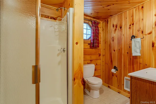 a view of a house with a door and wooden floor